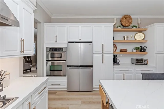 a view of a dining room with furniture and a flat screen tv