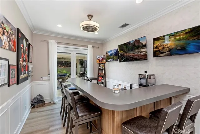a work room with furniture lamp and a window