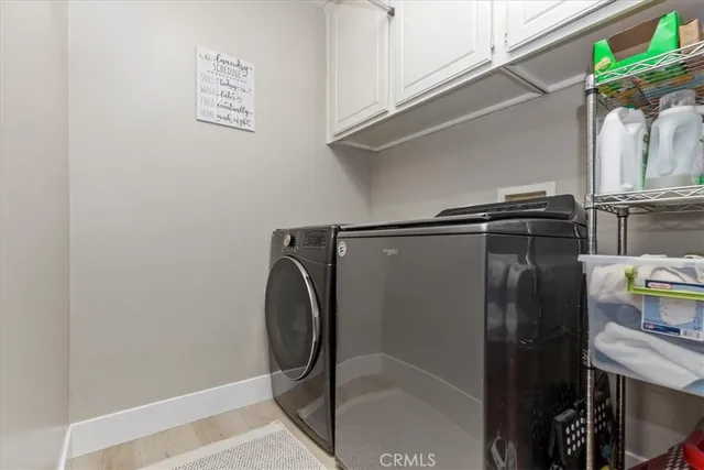 a spacious bathroom with a double vanity sink and a mirror