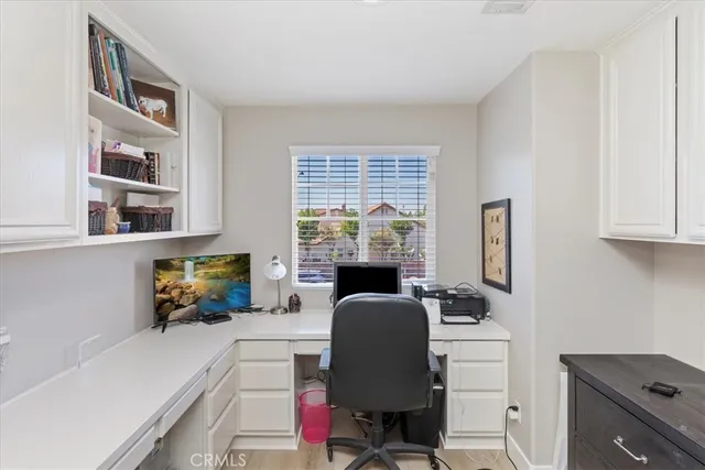 a bed room with a bed and a large window