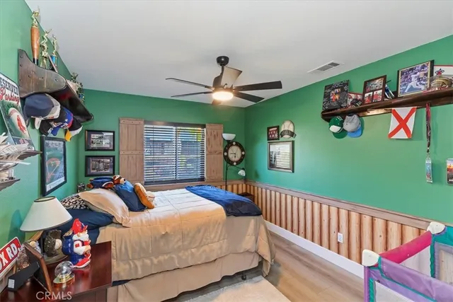 a view of a patio with couches and table and chairs and potted plants