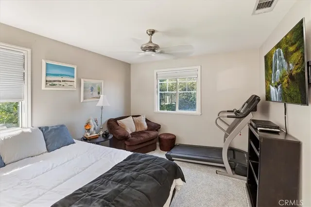 a outdoor space with patio the couches and a dining table with the view of the swimming pool