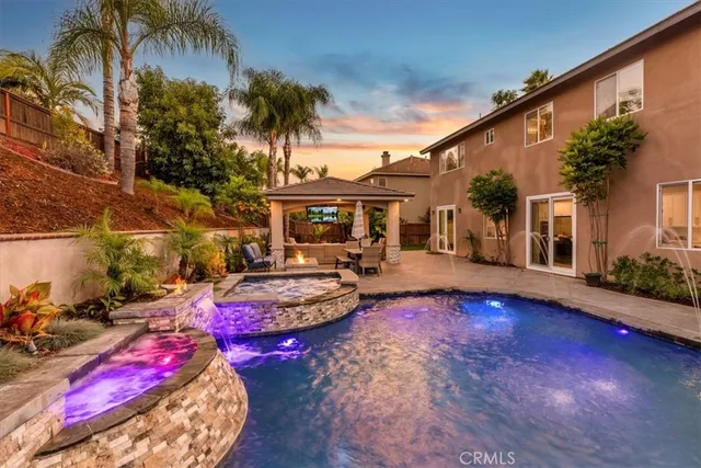 a view of an outdoor sitting area with a table and chairs