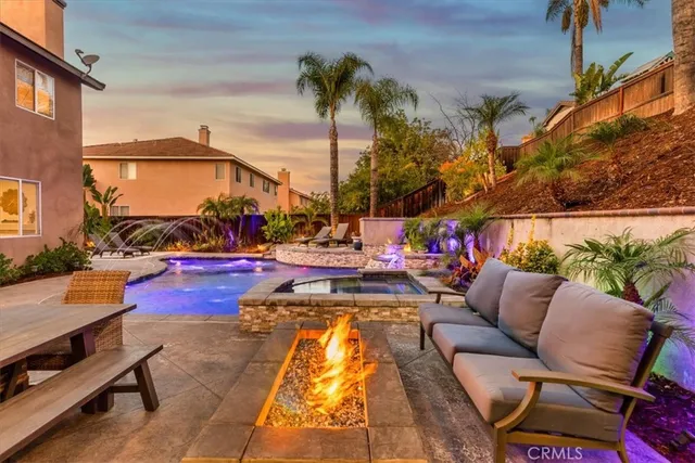 a view of a chairs and table in the patio