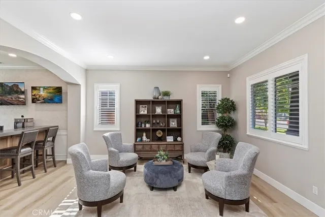 a living room with furniture a rug and a window