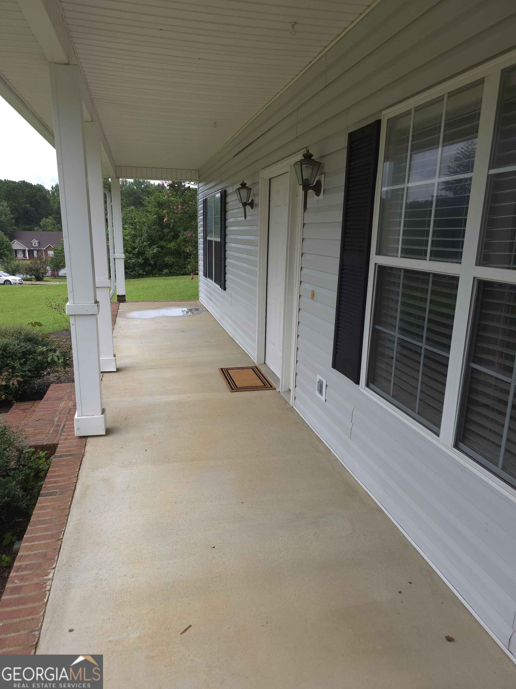 103 Windy Hill Court Dublin, GA 31021 - Photo 4 of 13 a view of a house with a porch