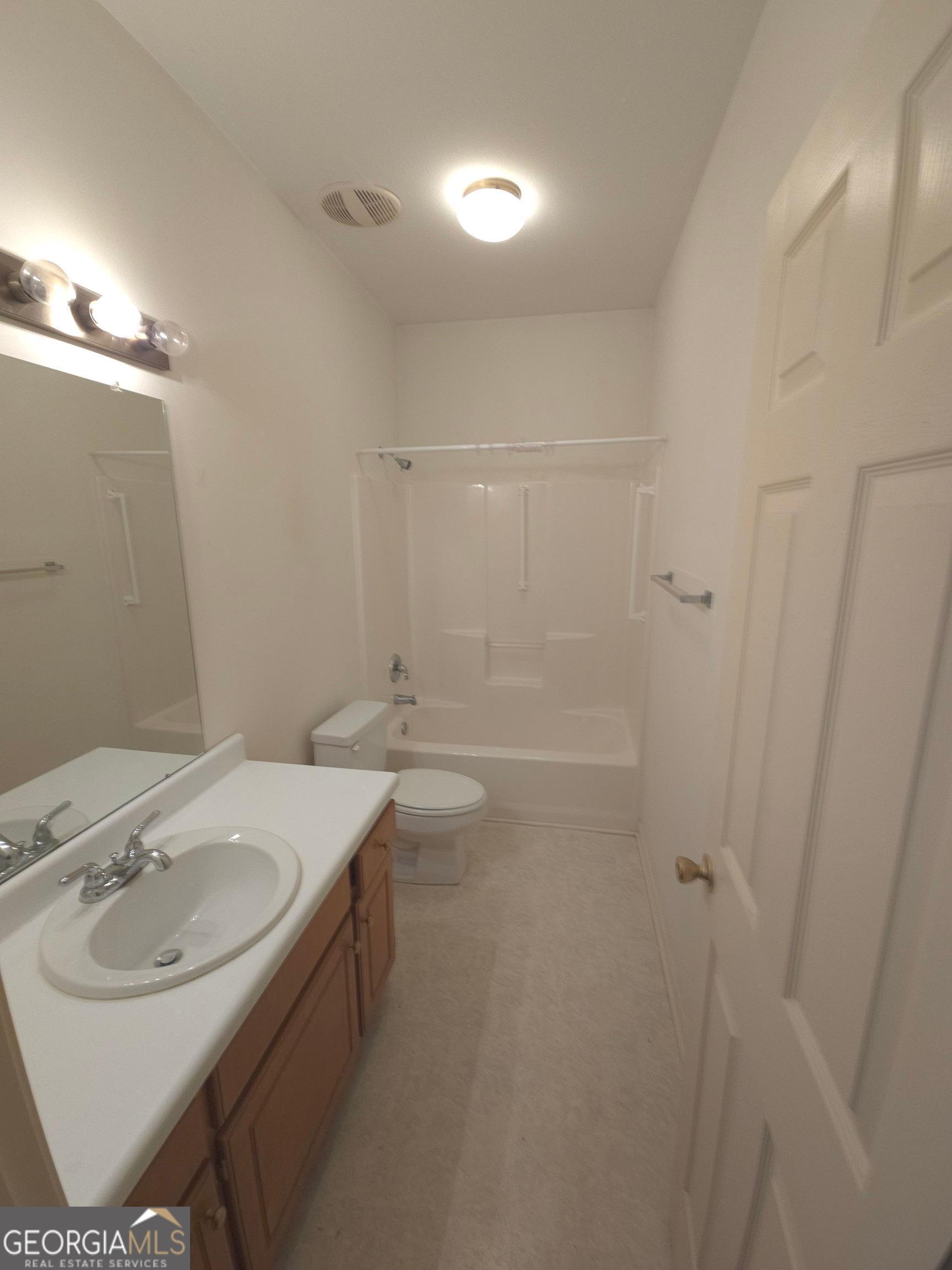 103 Windy Hill Court Dublin, GA 31021 - Photo 6 of 13 a bathroom with a sink and a mirror