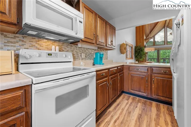 a kitchen with stainless steel appliances granite countertop a sink and cabinets