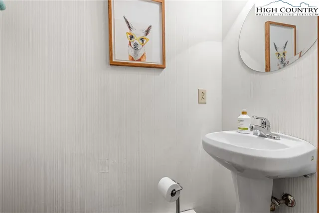 a bathroom with a sink and mirror