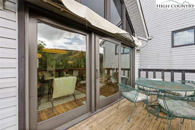 a view of porch with a furniture
