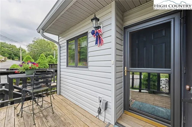 a view of a patio with table and chairs and potted plants