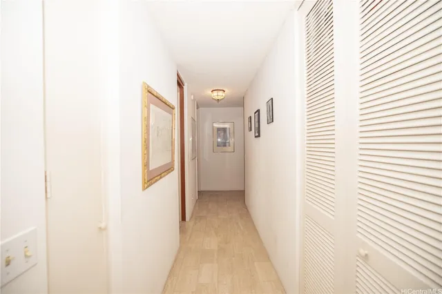 a view of a hallway with a white door