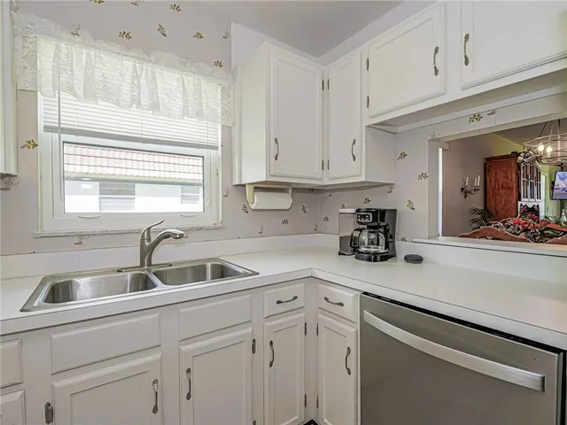 an aerial view of a house with a swimming pool yard and outdoor seating