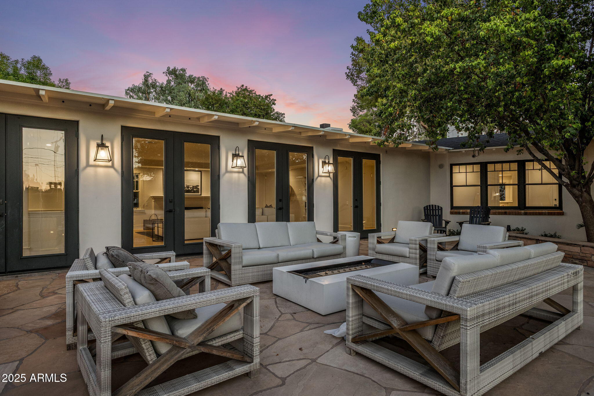 7030 North Wilder Road Phoenix, AZ 85021 - Photo 11 of 70 a view of a patio with couches table and chairs and potted plants