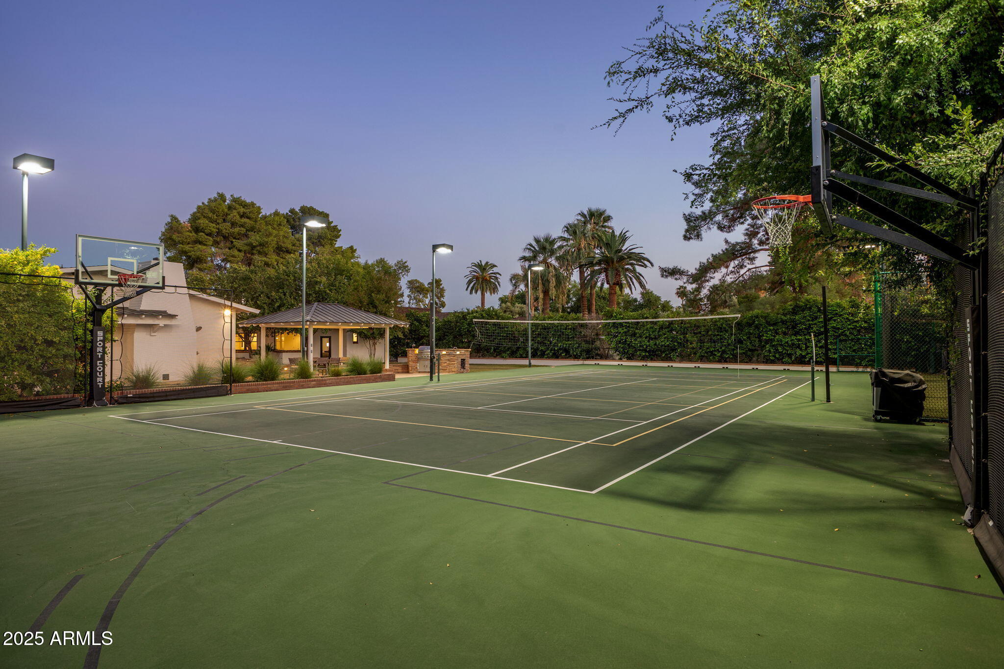 7030 North Wilder Road Phoenix, AZ 85021 - Photo 15 of 70 a view of a tennis ground with large trees