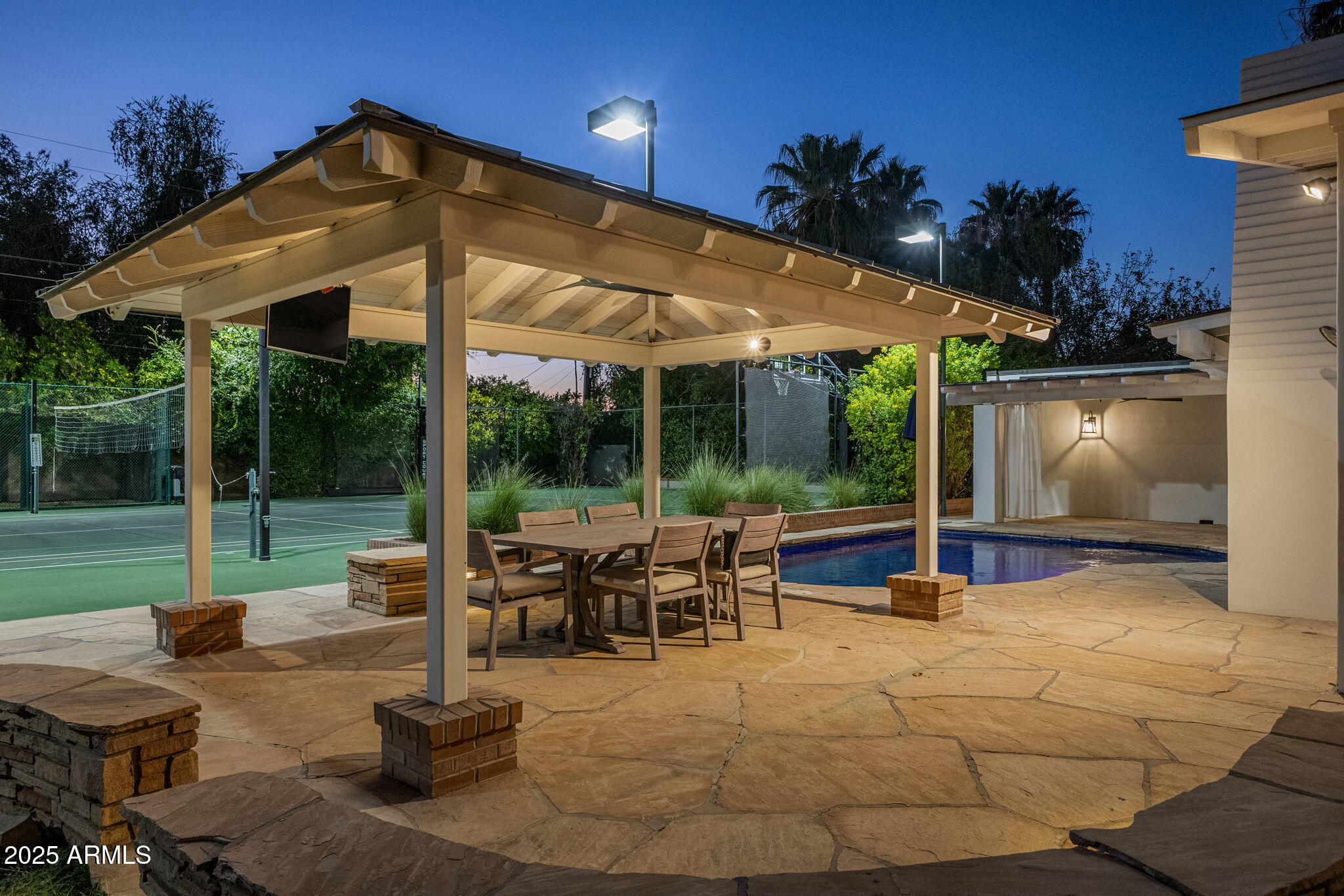 7030 North Wilder Road Phoenix, AZ 85021 - Photo 26 of 70 a view of a patio with a table chairs and a backyard