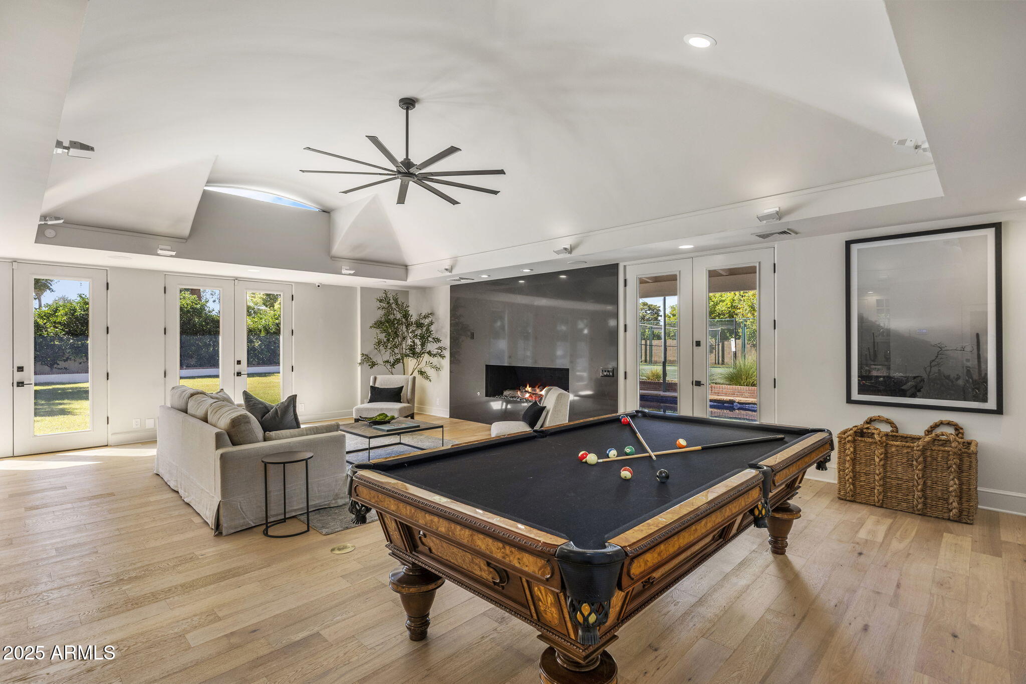7030 North Wilder Road Phoenix, AZ 85021 - Photo 28 of 70 a living room with furniture a flat screen tv and a large window