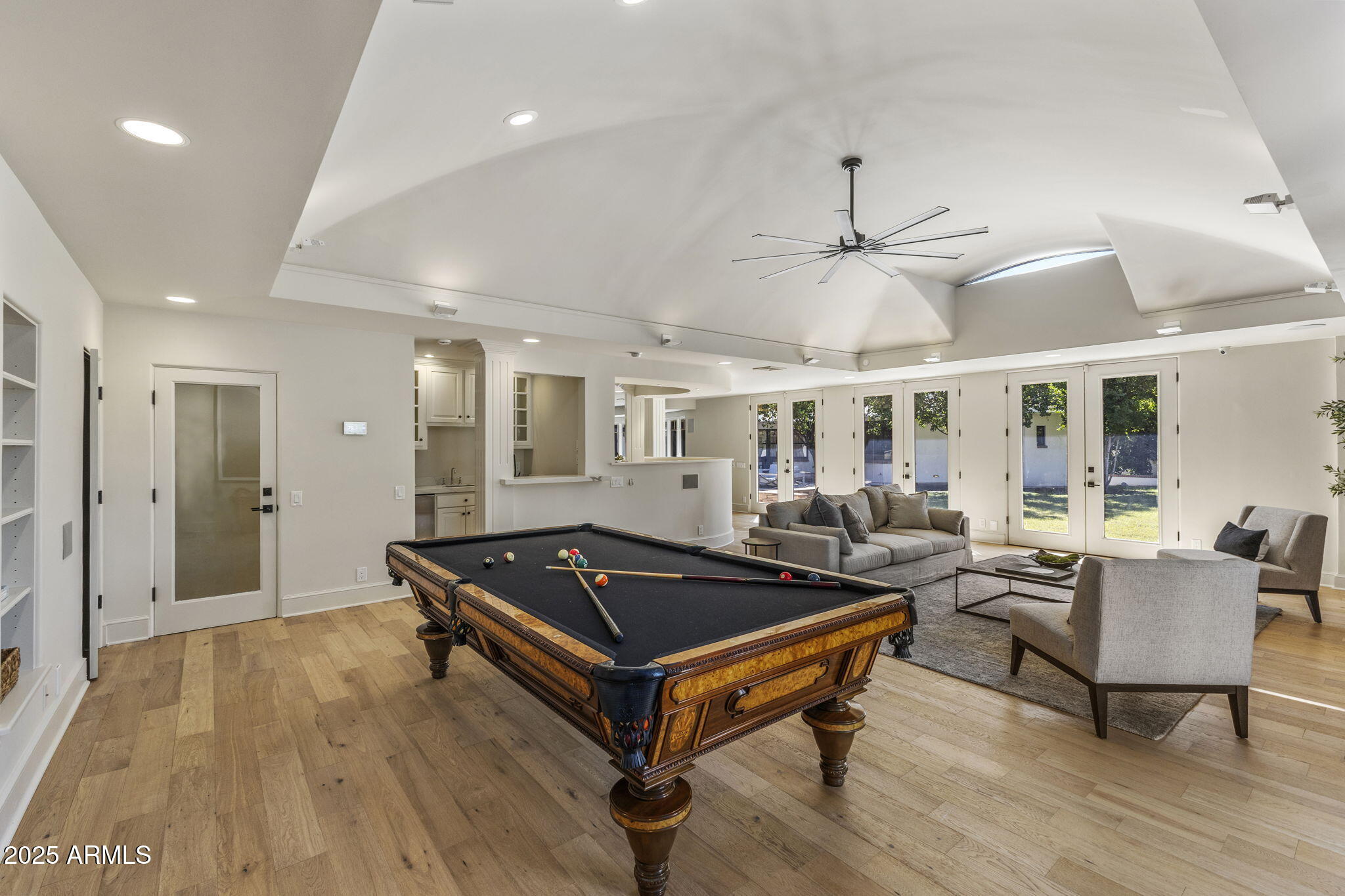 7030 North Wilder Road Phoenix, AZ 85021 - Photo 29 of 70 a living room with furniture a table and a chandelier
