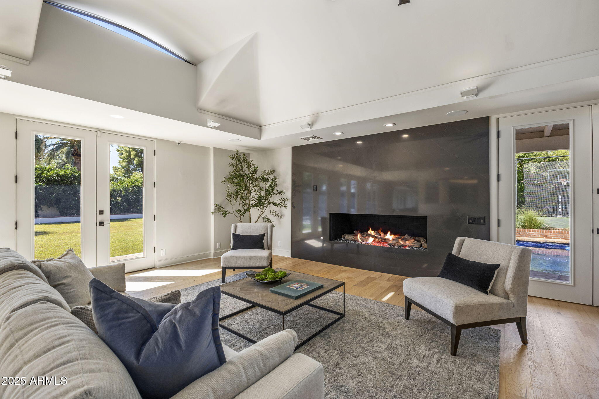 7030 North Wilder Road Phoenix, AZ 85021 - Photo 30 of 70 a living room with furniture and a fireplace