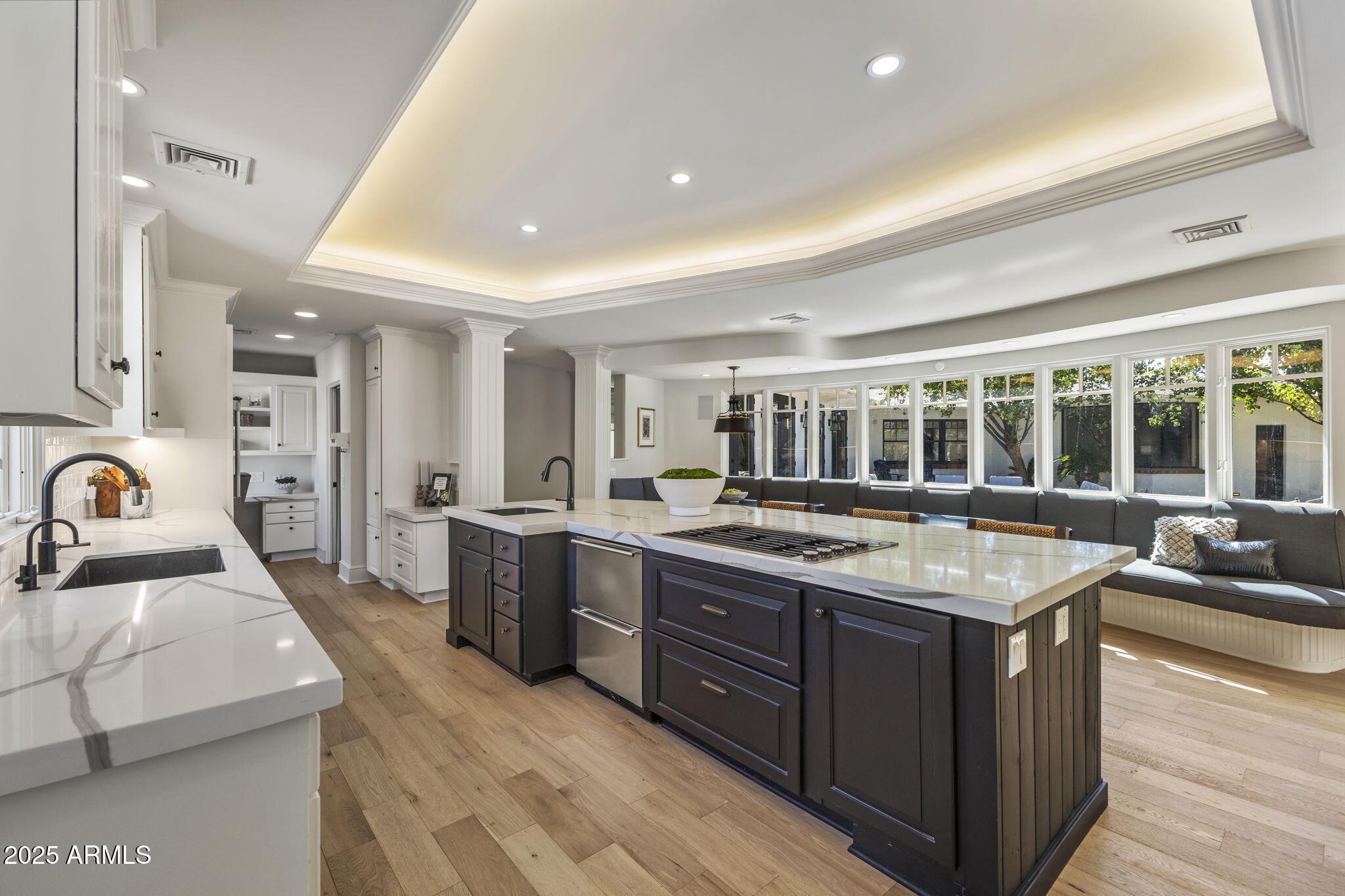 7030 North Wilder Road Phoenix, AZ 85021 - Photo 36 of 70 a large kitchen with kitchen island a sink a stove and a refrigerator