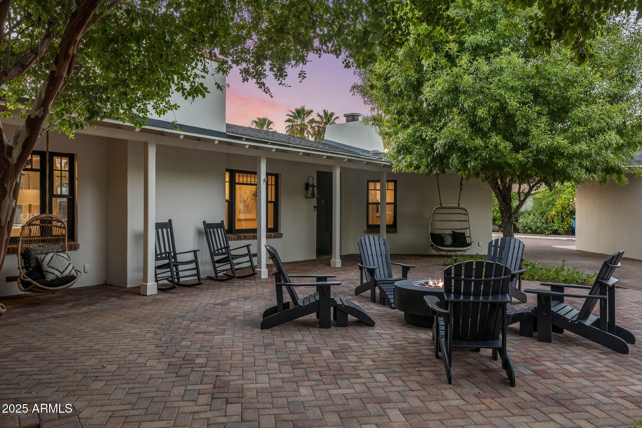 7030 North Wilder Road Phoenix, AZ 85021 - Photo 4 of 70 a view of a patio with table and chairs and floor to ceiling window