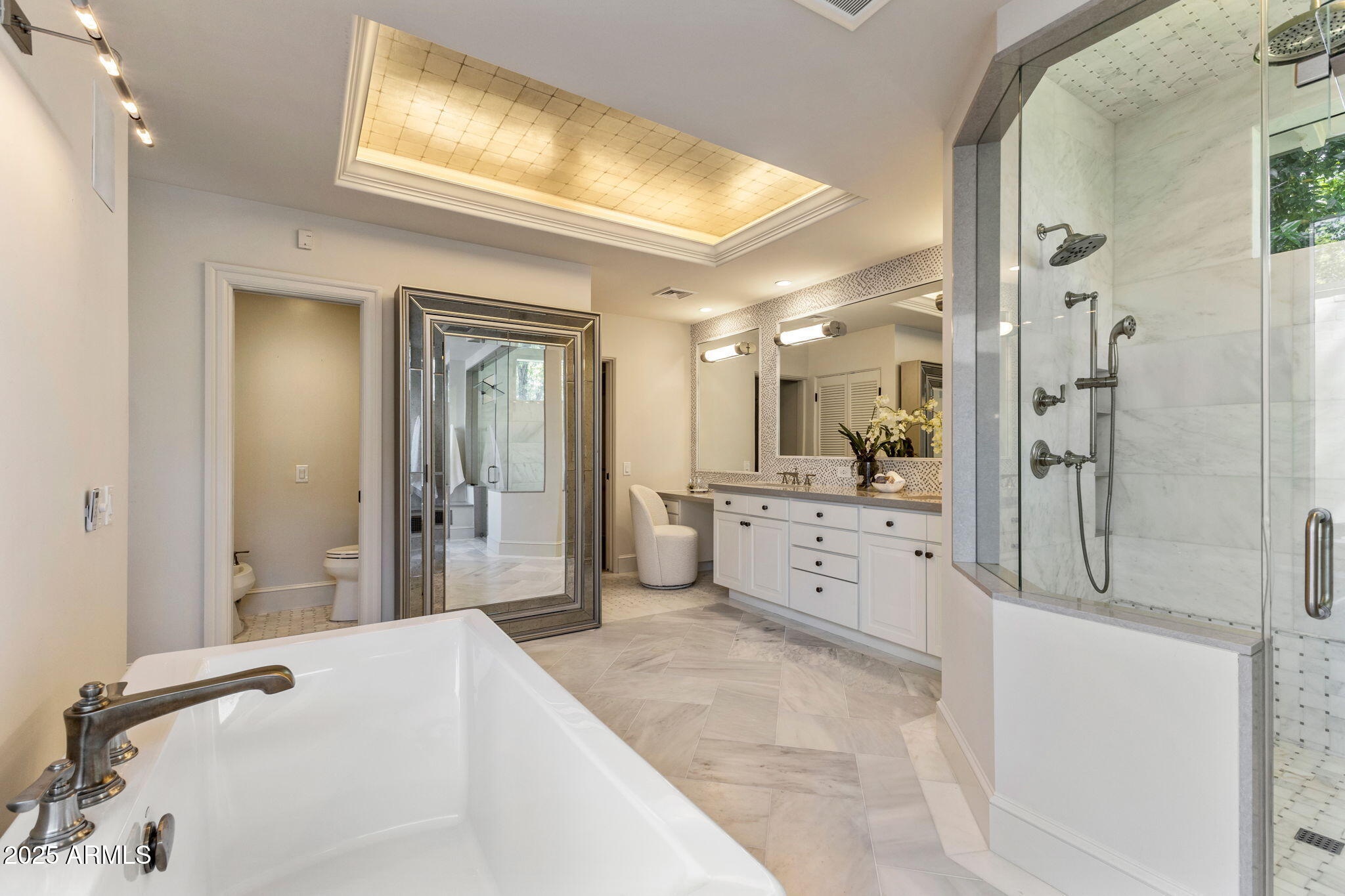 7030 North Wilder Road Phoenix, AZ 85021 - Photo 57 of 70 a large white bathroom with a large mirror vanity and shower