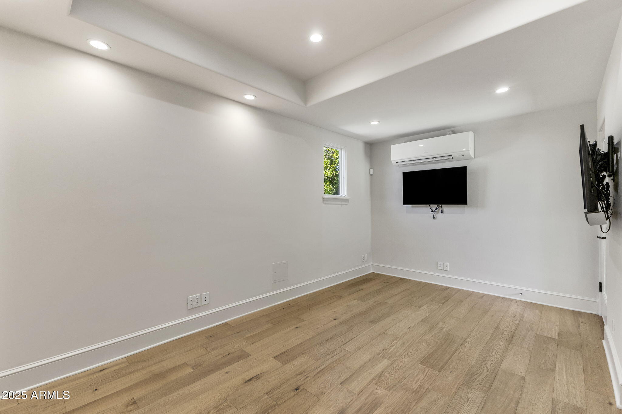 7030 North Wilder Road Phoenix, AZ 85021 - Photo 67 of 70 a view of empty room with wooden floor and fan