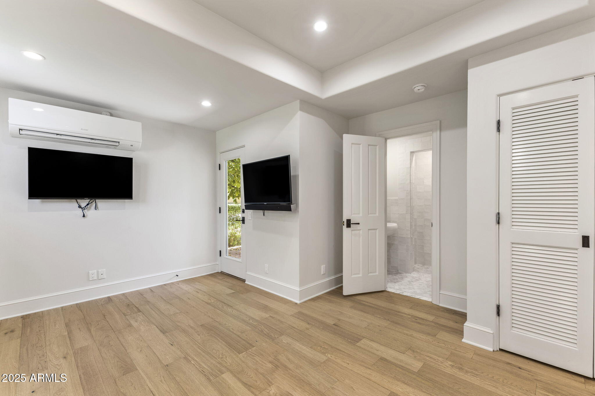 7030 North Wilder Road Phoenix, AZ 85021 - Photo 68 of 70 a view of an empty room with wooden floor and a window