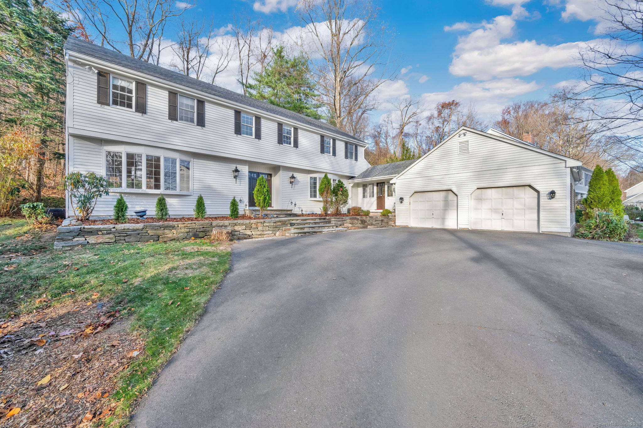 75 Arlen Way West Hartford, CT 06117 - Photo 1 of 39 a view of a white house with a yard