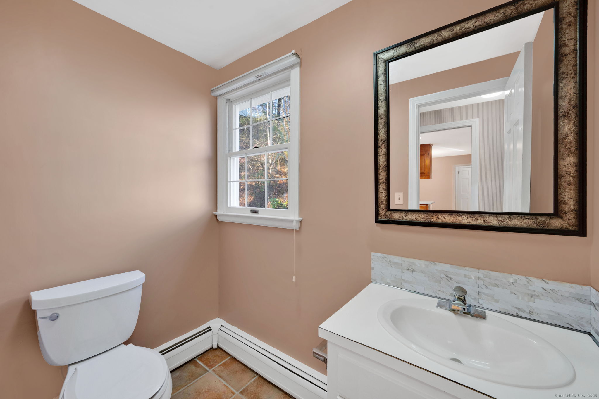 75 Arlen Way West Hartford, CT 06117 - Photo 21 of 39 a bathroom with a toilet sink vanity and mirror