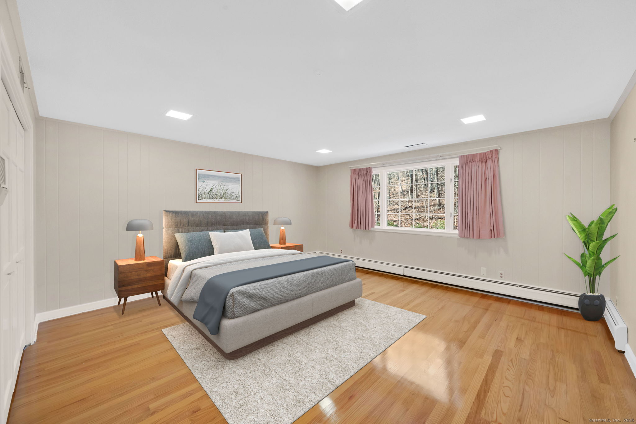 75 Arlen Way West Hartford, CT 06117 - Photo 26 of 39 a spacious bedroom with a large bed and a potted plant