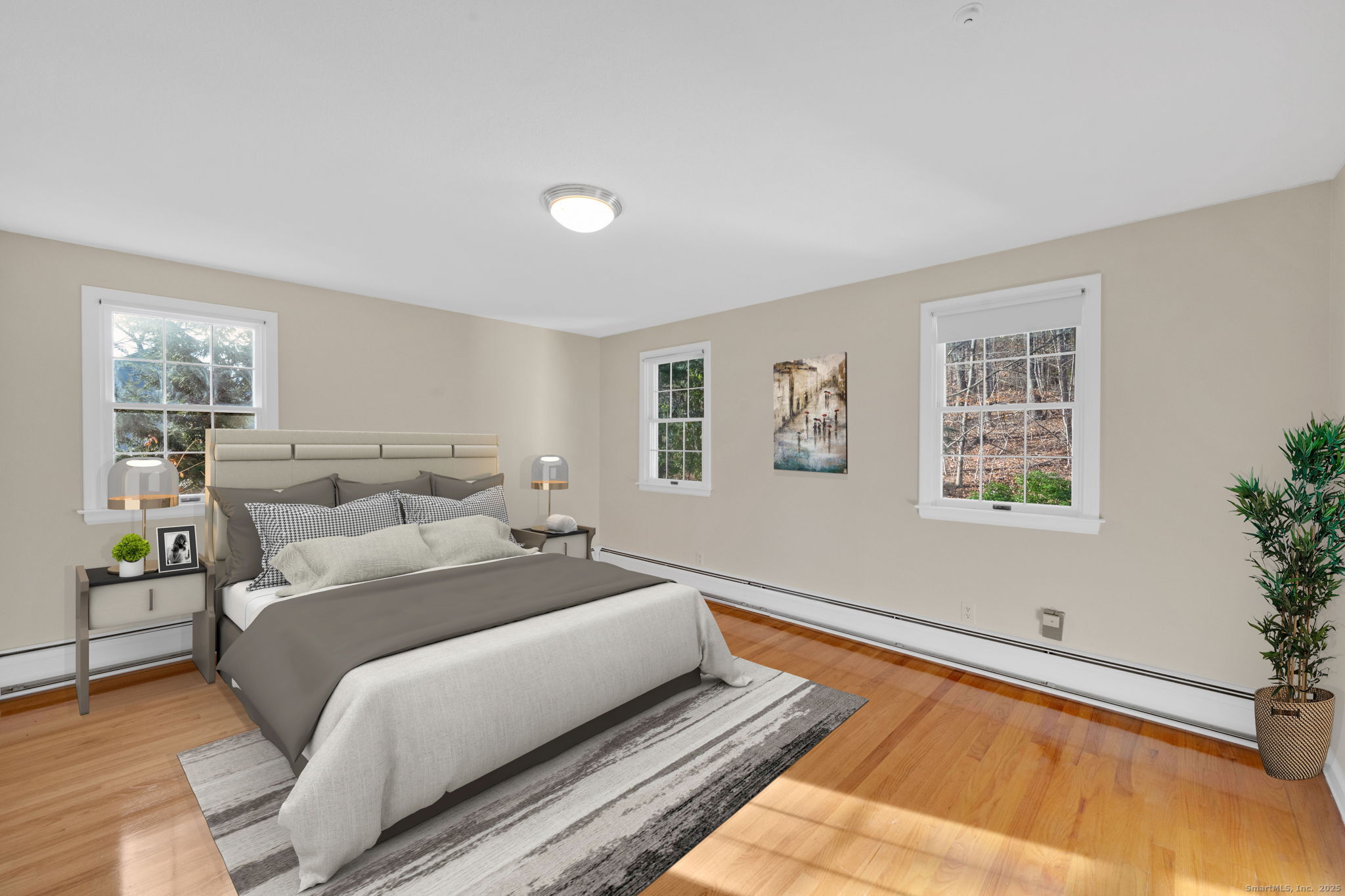 75 Arlen Way West Hartford, CT 06117 - Photo 27 of 39 a bedroom with a bed and wooden floor