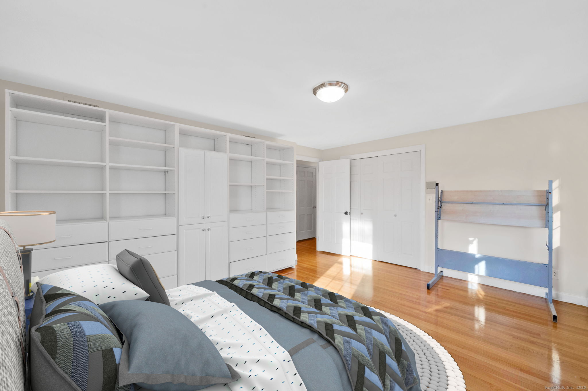 75 Arlen Way West Hartford, CT 06117 - Photo 28 of 39 a bedroom with a bed and a cabinets