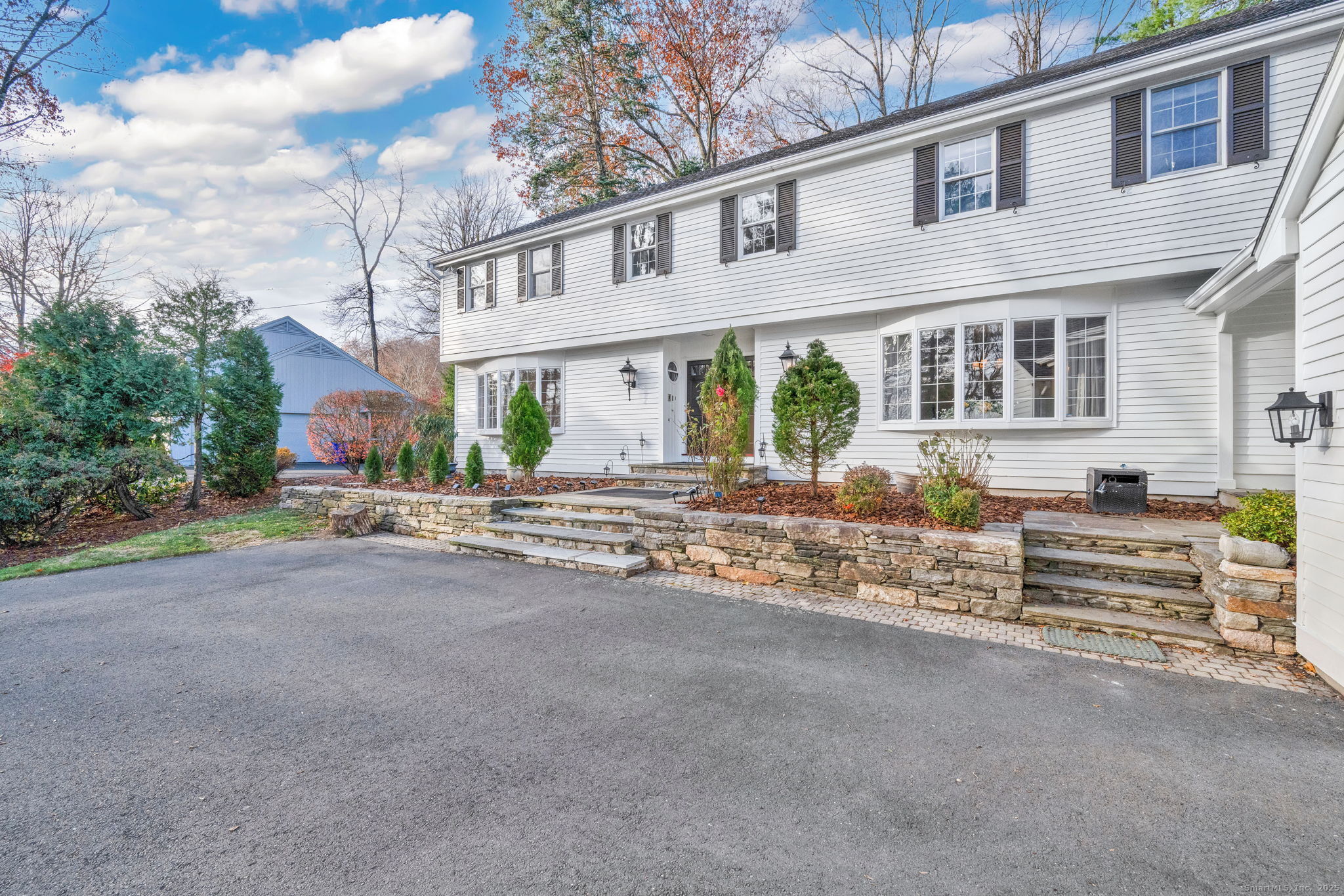 75 Arlen Way West Hartford, CT 06117 - Photo 3 of 39 a front view of a house with garden