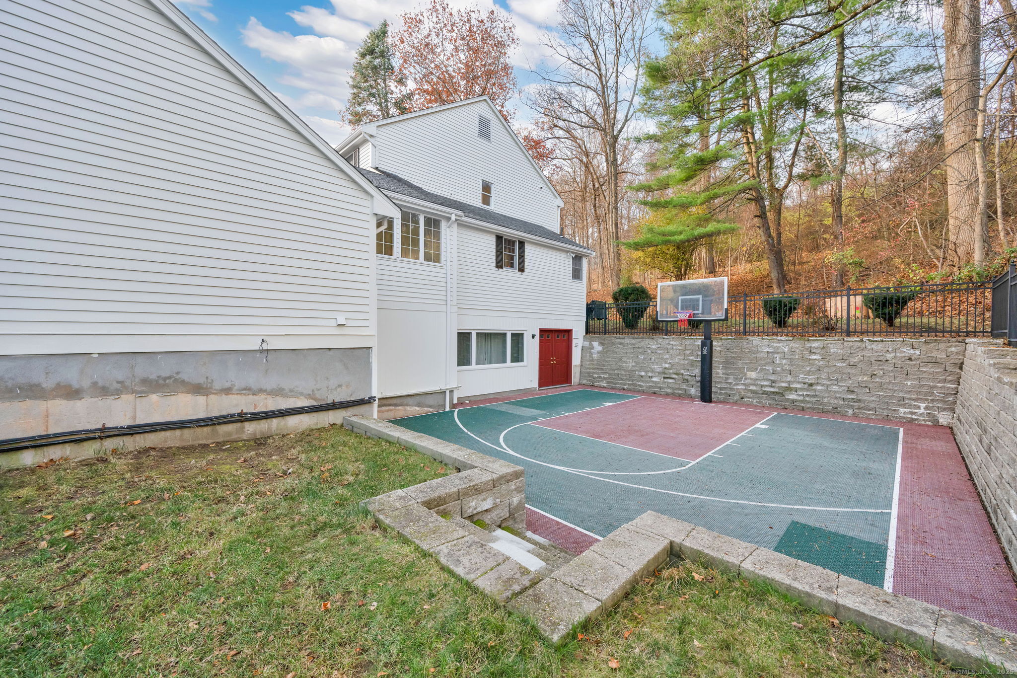 75 Arlen Way West Hartford, CT 06117 - Photo 6 of 39 a view of a white house with a yard and large tree