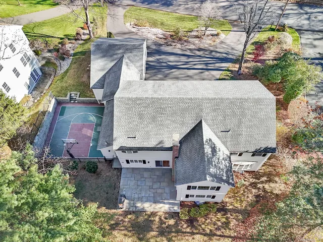 an aerial view of a house with a yard