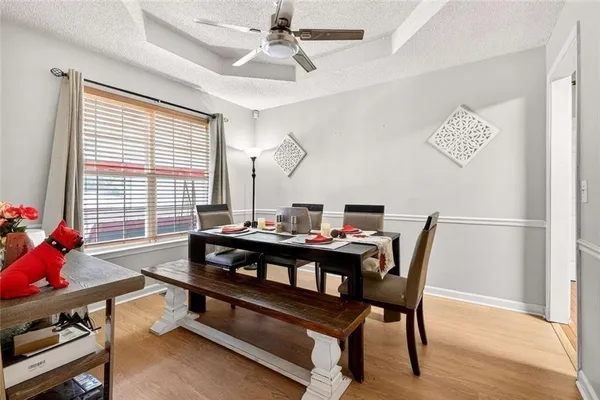a view of a livingroom with workspace and a window