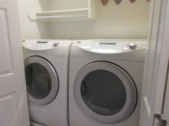 a utility room with dryer and washer
