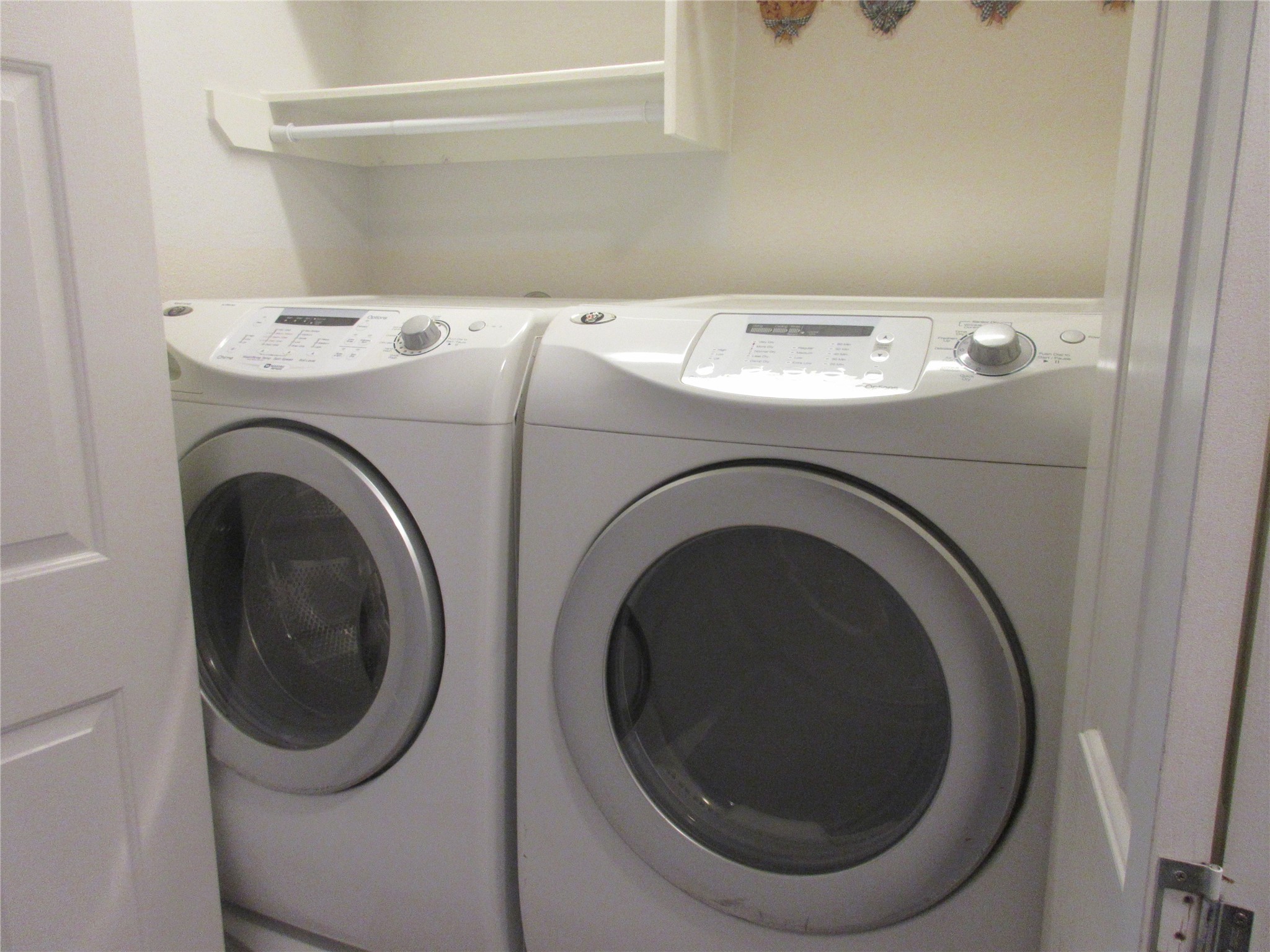 17522 Bering Bridge Lane Humble, TX 77346 - Photo 13 of 16 a utility room with dryer and washer
