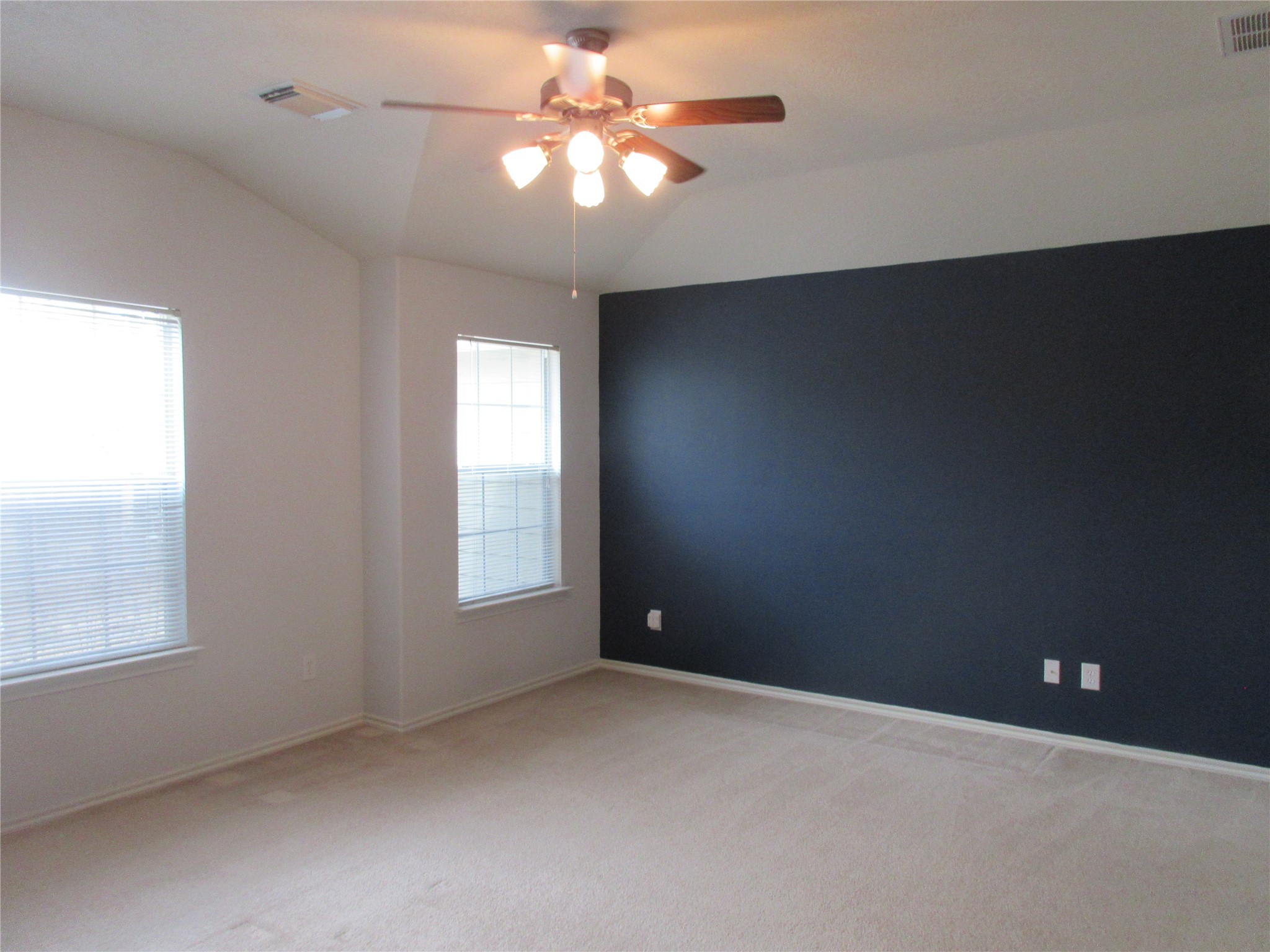 17522 Bering Bridge Lane Humble, TX 77346 - Photo 7 of 16 an empty room with windows and fan