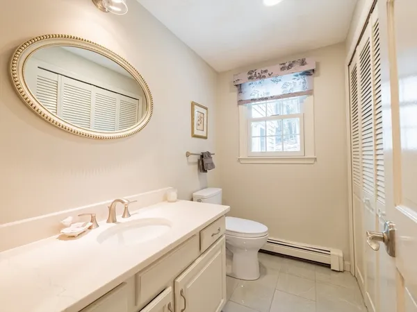 a view of a hallway with wooden floor and stairs