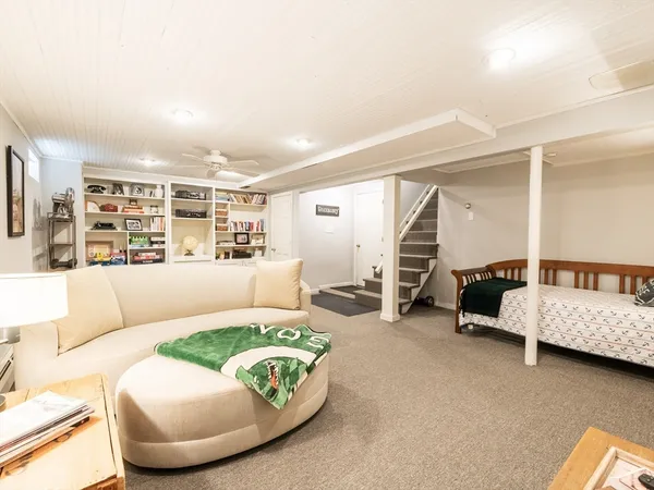 a shelf with books and knick knacks on it