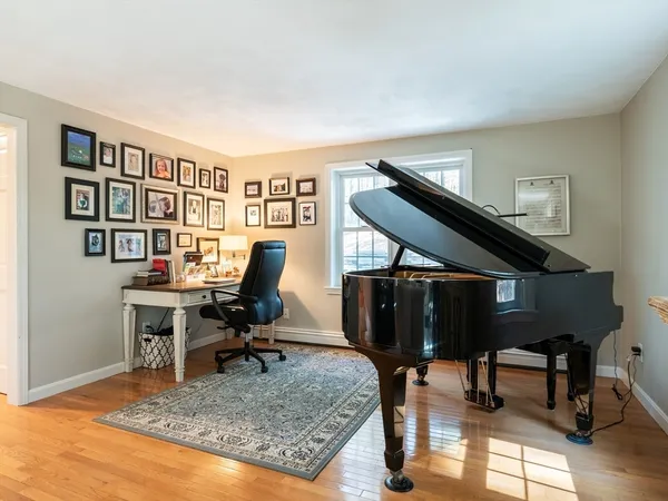 a view of a livingroom with furniture and a workspace