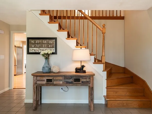 a view of a a dining room with furniture window and wooden floor