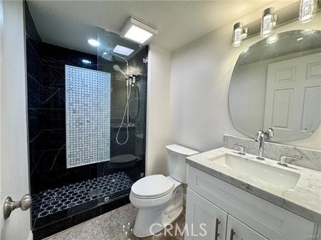 2410 Pointer Drive Walnut, CA 91789 - Photo 15 of 35 a bathroom with a sink a toilet and shower