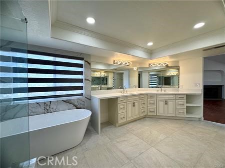2410 Pointer Drive Walnut, CA 91789 - Photo 20 of 35 a bathroom with a bathtub and double vanity