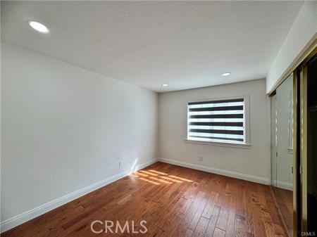 2410 Pointer Drive Walnut, CA 91789 - Photo 26 of 35 a view of an empty room with wooden floor and a window