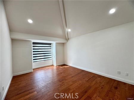 2410 Pointer Drive Walnut, CA 91789 - Photo 28 of 35 an empty room with wooden floor and windows