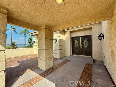 2410 Pointer Drive Walnut, CA 91789 - Photo 4 of 35 a view of a hallway with wooden walls and bench