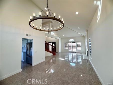 2410 Pointer Drive Walnut, CA 91789 - Photo 7 of 35 an open space with a chandelier fan and kitchen view